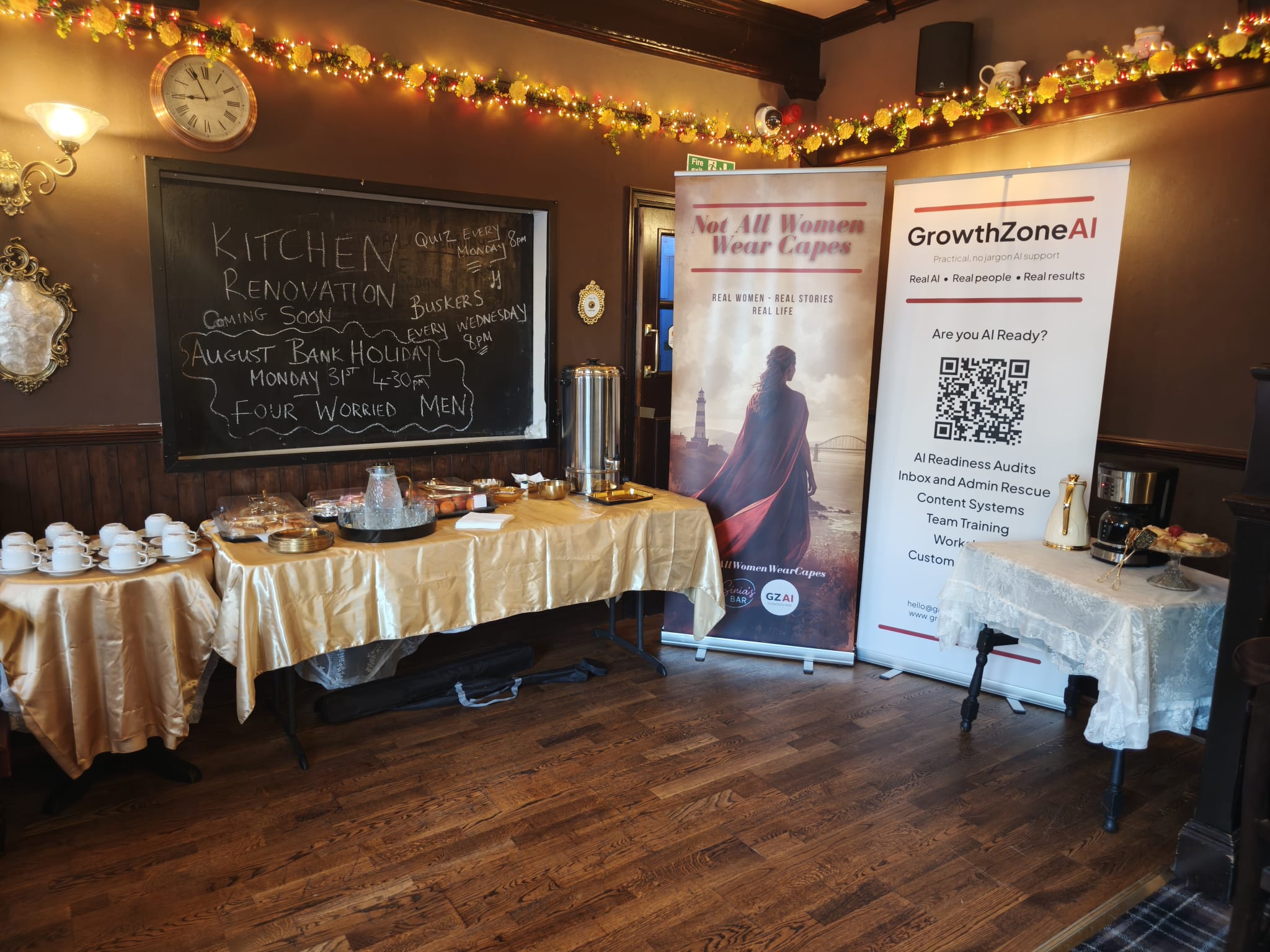 The #NotAllWomenWearCapes Bring Your Brilliance event room set up with the GrowthZone AI banner, breakfast buffet and refreshments